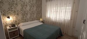 Postel nebo postele na pokoji v ubytování Hostal Linar