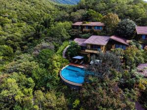 an aerial view of a house with a swimming pool at Gamma Monterrey Rincon de Santiago in Santiago