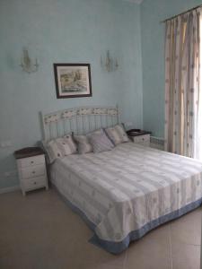 a bedroom with a large bed and two night stands at Oasis Resort & Spa 2 floor with sea view Gen in Lozenets