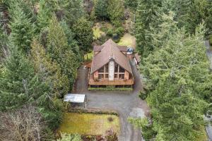 an overhead view of a house in the woods at Chalet Style Cottage near Shawnigan Lake in Shawnigan Lake