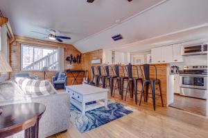 a living room with a couch and a table at The Cove in Alton