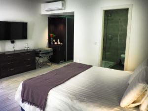 Posteľ alebo postele v izbe v ubytovaní Adelphi Boutique Hotel