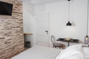 Posteľ alebo postele v izbe v ubytovaní Vinea Suites