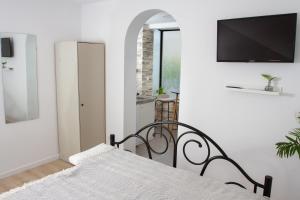 Posteľ alebo postele v izbe v ubytovaní Vinea Suites