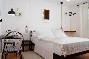 Posteľ alebo postele v izbe v ubytovaní Vinea Suites
