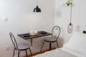 Posteľ alebo postele v izbe v ubytovaní Vinea Suites
