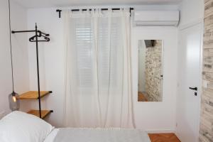 Posteľ alebo postele v izbe v ubytovaní Vinea Suites