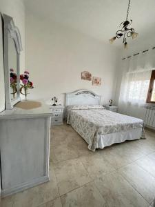 A bed or beds in a room at Masseria Paglieroni