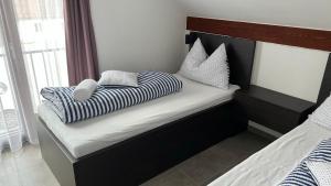 Postel nebo postele na pokoji v ubytování Apartmán D5 Nová Pec