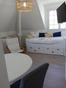 TV a/nebo společenská místnost v ubytování Appartement 2 pièces proche du centre ville