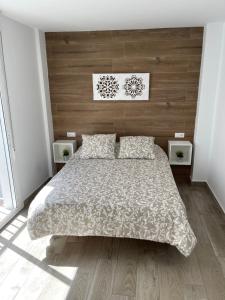 A bed or beds in a room at apartamento banferra