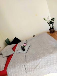 a bedroom with a white bed with pillows at Studio Concept Apartment in Zagreb