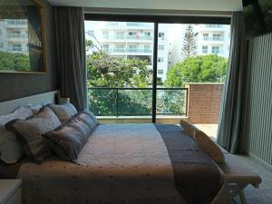 Een bed of bedden in een kamer bij Nova Onda Hotel
