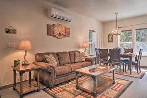 a living room with a couch and a table at Darby Cabin in National Forest Walk to River! in Darby