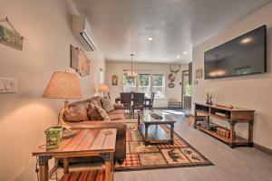 a living room with a couch and a table at Darby Cabin in National Forest Walk to River! in Darby