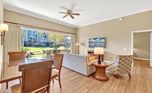 a living room with a couch and a table at K B M Resorts- HKK-104 Gorgeous resort view 2bed , 2ba with large lanai in Kaanapali