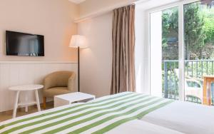Postel nebo postele na pokoji v ubytování Hotel Playa Sol
