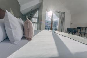 Ένα ή περισσότερα κρεβάτια σε δωμάτιο στο Saska Boutique Hotel