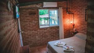 Postel nebo postele na pokoji v ubytování Hotel alamos de la puntilla + 19 fotografií