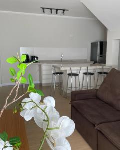 a living room with a couch and a table at Almada Studio 77 in Cunha