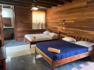 Postel nebo postele na pokoji v ubytování Perla Negra Beachfront + 37 fotografií