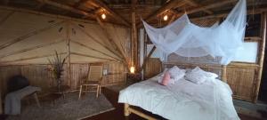 Postel nebo postele na pokoji v ubytování Ecohotel Soplo del Tambo