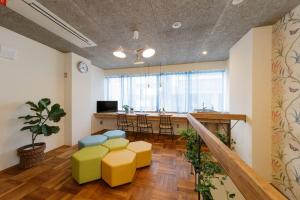 a living room with a kitchen and a dining room at Guest House Sora 3rooms in Osaka