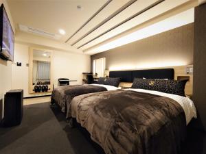Postelja oz. postelje v sobi nastanitve Green Rich Hotel Matsue Station Across - Artificial hot spring Futamata Yunohana