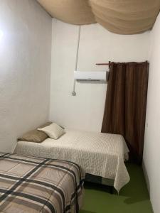 Postel nebo postele na pokoji v ubytování Hotel Chulamar, Piscina y Restaurante