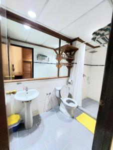 a bathroom with a toilet and a sink at Sutera Inn Prima Hotel in Kota Bharu