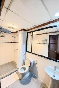 a bathroom with a toilet and a sink at Sutera Inn Prima Hotel in Kota Bharu