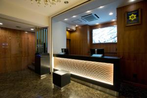 a lobby with a reception desk in a building at Kadoya Hotel in Tokyo