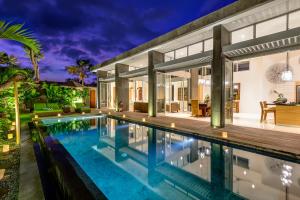 an image of a house with a swimming pool at Aramanis Villas in Seminyak