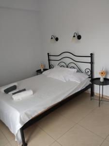 En eller flere senge i et værelse på Villa Camellia