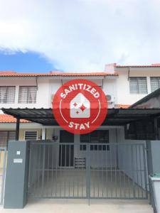 a building with a red sign in front of it at OYO 90493 JL Homestay in Segamat