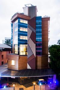 a building with a geometric design on the side of it at Hotel Guruvayur Darshan in Guruvāyūr