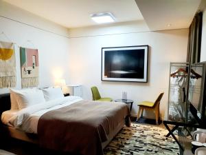 Ένα ή περισσότερα κρεβάτια σε δωμάτιο στο JS Boutique Hotel