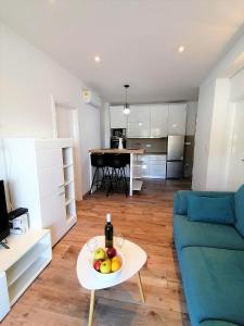 a living room with a table with fruit on it at Corallium Imperiale in Goveđari