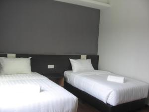 Postel nebo postele na pokoji v ubytování 707 Hotel (Cheng Ho ) Melaka