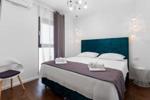 Postel nebo postele na pokoji v ubytování Villa Mare's 1