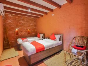 Łóżko lub łóżka w pokoju w obiekcie Kathmandu Cottage - Boutique