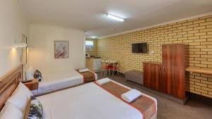 En eller flere senger på et rom på Bryants Motel Roma