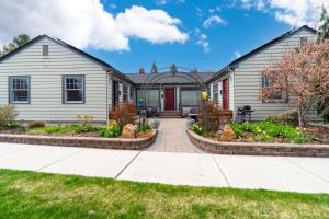 a house with a brick walkway leading to the front yard at Drake Cottage 311 in Bend
