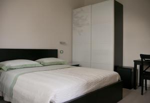 A bed or beds in a room at Le Stanze di Bacco