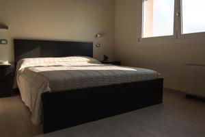 A bed or beds in a room at Le Stanze di Bacco