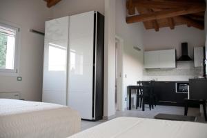 A bed or beds in a room at Le Stanze di Bacco