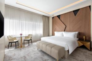 Ένα ή περισσότερα κρεβάτια σε δωμάτιο στο Steigenberger Hotel Doha