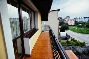 a balcony of a building with a view of a street at Tanie Noclegi 2 in Kielce