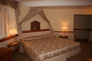Ένα ή περισσότερα κρεβάτια σε δωμάτιο στο Hotel Lorenzetti