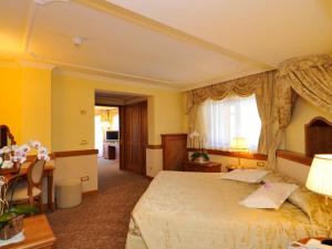 Ένα ή περισσότερα κρεβάτια σε δωμάτιο στο Hotel Lorenzetti